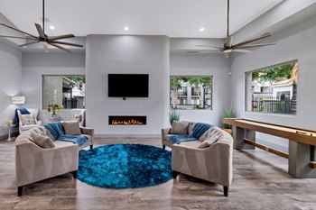 Modern clubhouse lounge with fireplace and flat screen tv